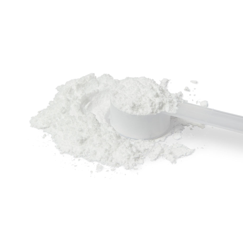 White powder with a white scoop on a white background