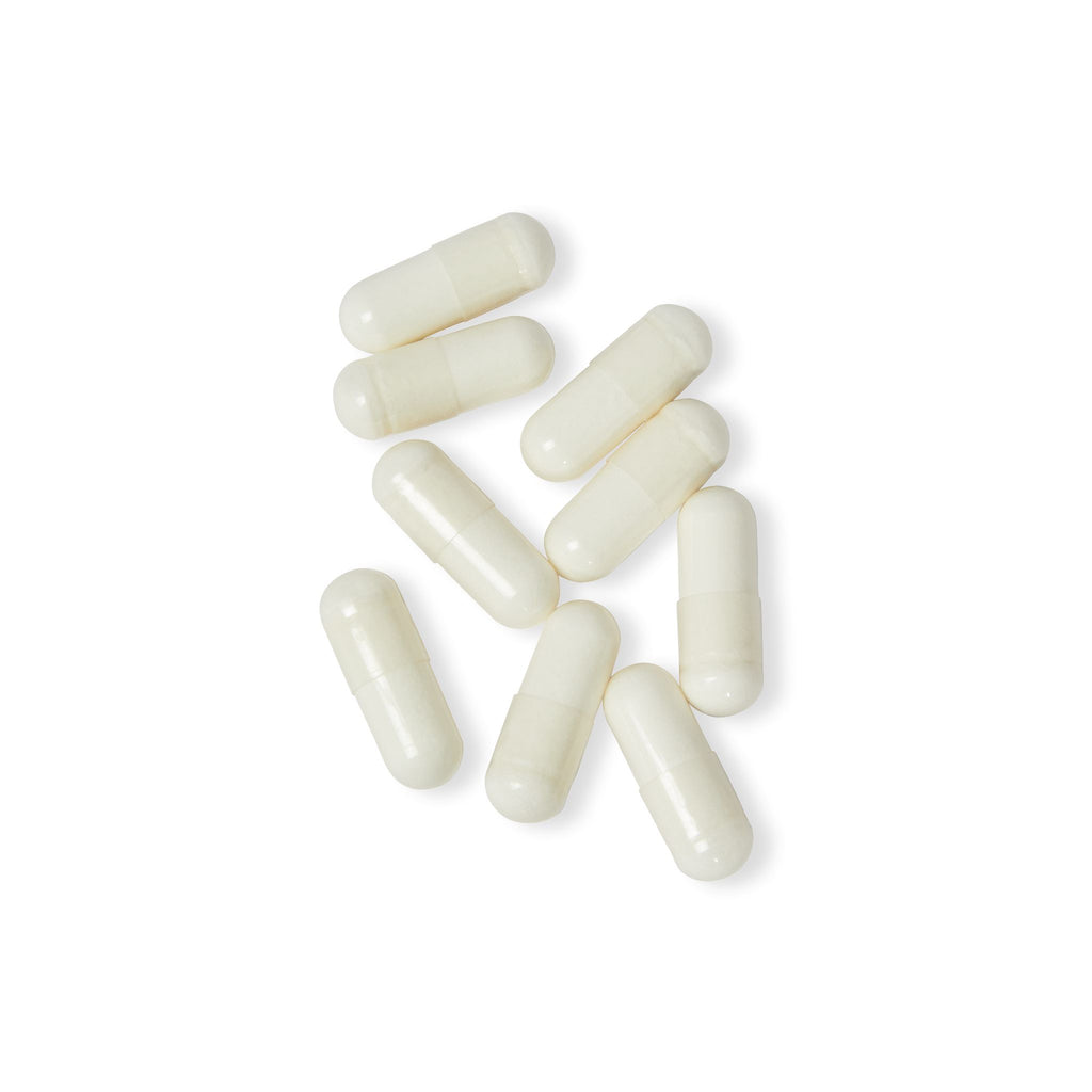White capsules on a white background