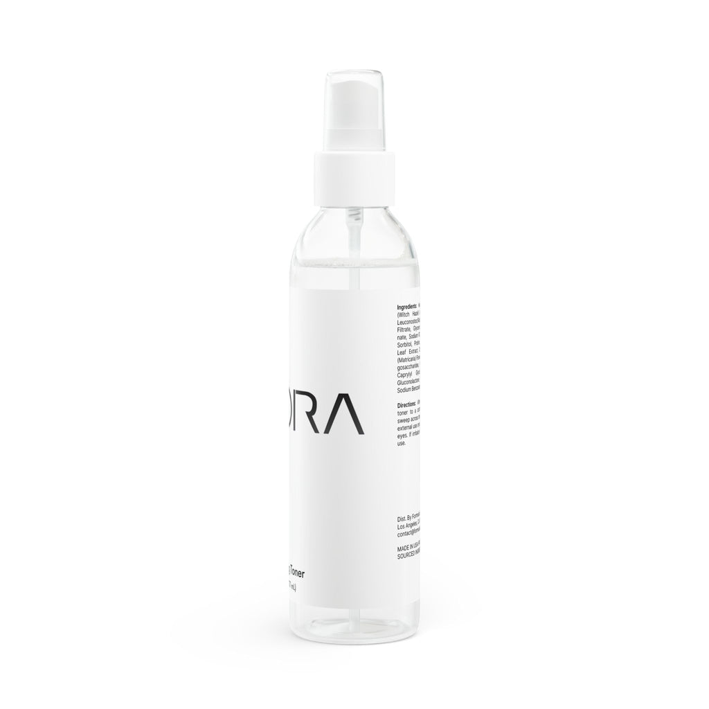 Clear spray bottle with 'EXORA' branding on a white background