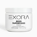 White container of Exora Reds Superfood Powder on a white background