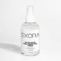 EXORA witch hazel pore perfecting toner bottle on a white background