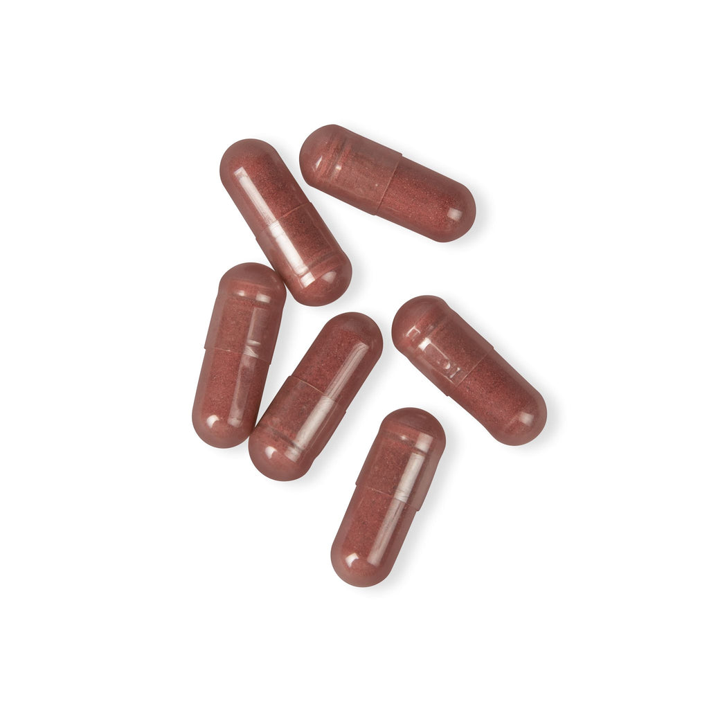 Red capsules on a white background