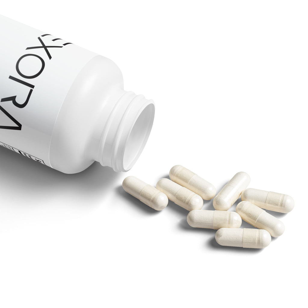 White bottle labeled 'EXORA' with white capsules on a light gray background