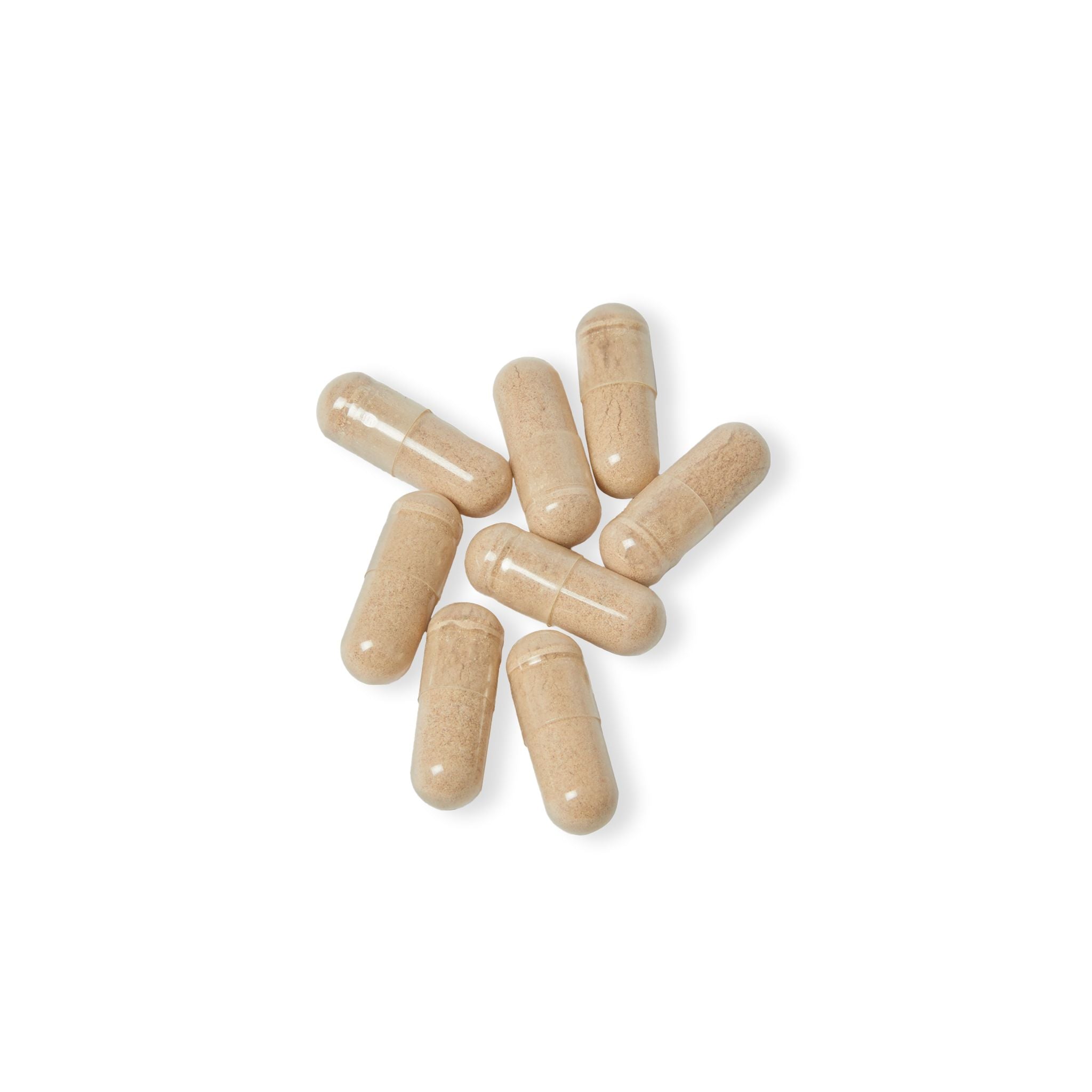 Beige capsules on a white background
