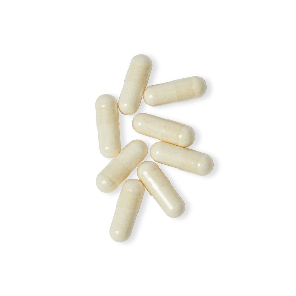 White capsules on a white background