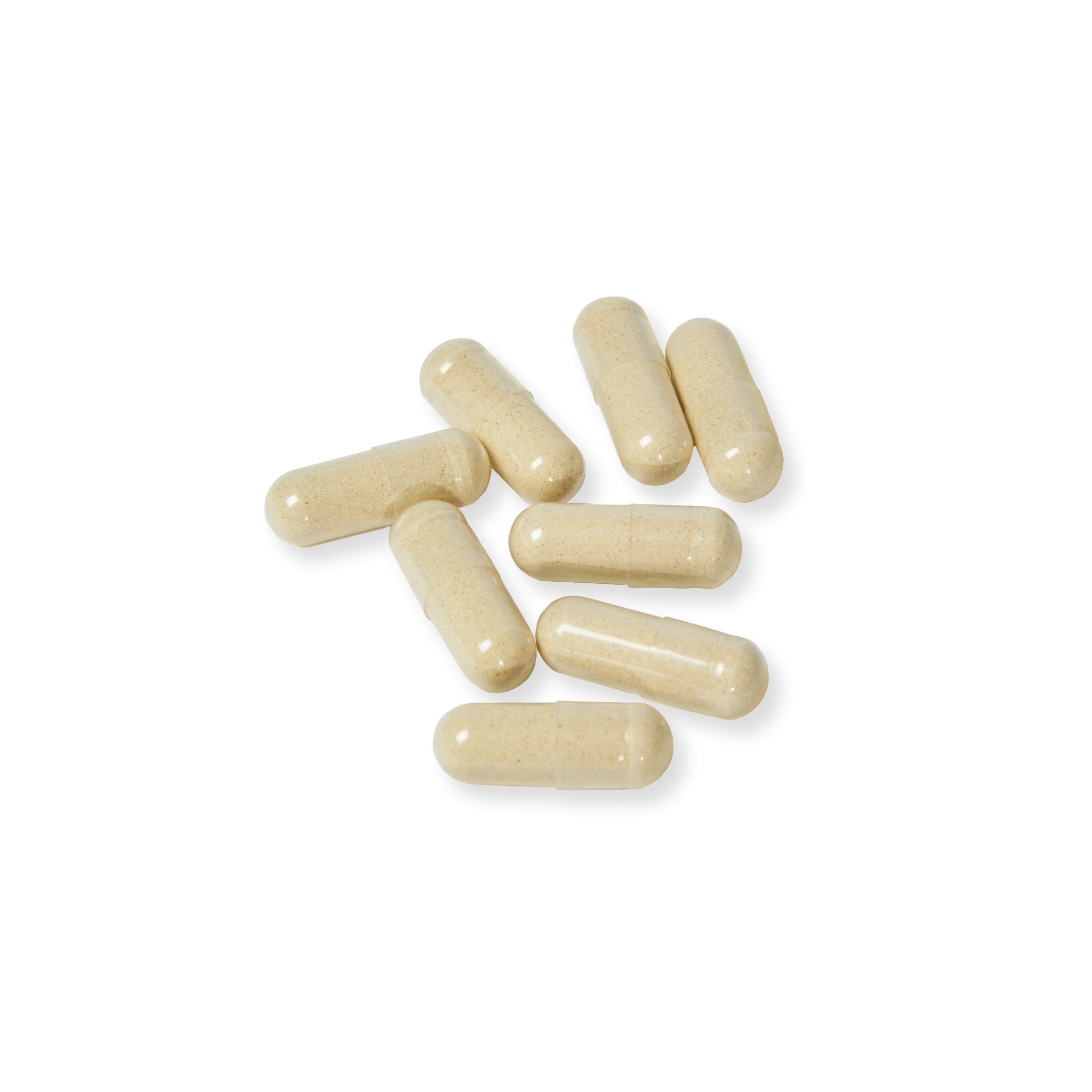 Beige capsules on a white background